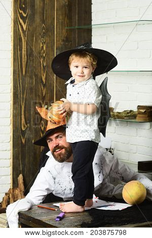 Halloween And Party Concept. Witcher And Little Magician