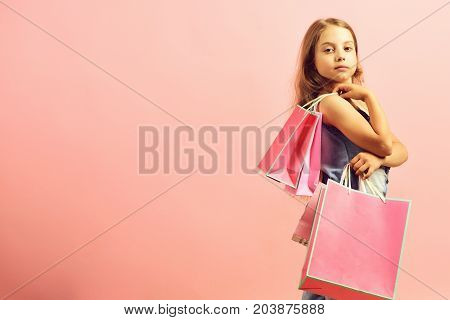 School Girl With Packages Isolated On Pink Background