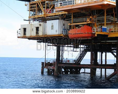 Life boat or survival craft at muster station of oil and gas drilling rig