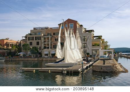 View of the embankment of the seaside town of Tivat in the autumn day. Montenegro