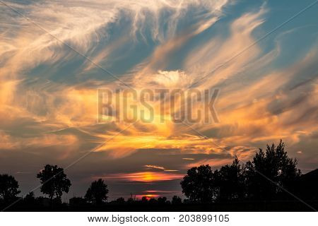 Spectacular sunset and coloured clouds captured in the Po Valley (Italy)
