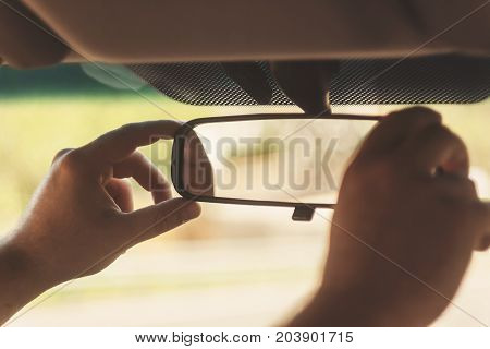 Man's Hand Corrects The Rear-view Mirror In The Car, Retro Toning