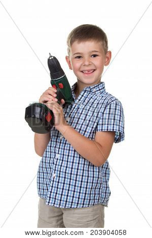 A small happy boy in the plaid shirt holds a screwdriver pretending he is a builder, isolated on white background.