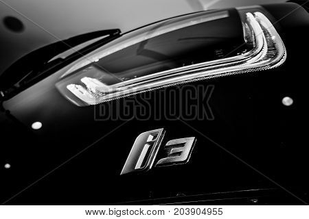 BERLIN - NOVEMBER 28 2014: Showroom. Stoplight of the BMW i3 previously Mega City Vehicle (MCV) is a five-door urban electric car developed by the German manufacturer BMW. Black and white.