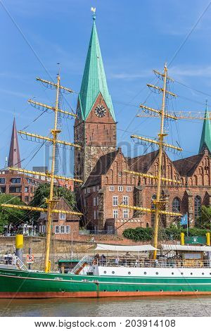 BREMEN, GERMANY - AUGUST 23, 2017: Historical church tower along the river Weser in Bremen, Germany