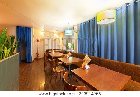 MOSCOW - AUGUST 2014: The interior of a small modern cozy cafe - "SHERDOR". Hall with sofa and tables