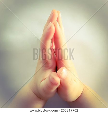 close up photo of praying child hands.