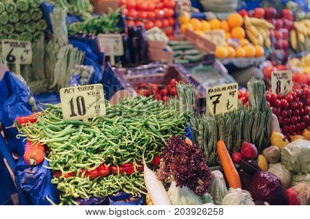 Melike Hatun Bazaar (Women Bazaar) Vegetables fruits and spices in traditional typical Turkish grocery bazaar top view. Bazaar in Turkey. On the show-window the price lists with the price and the name of the vegetables