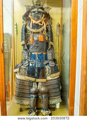 KYOTO, JAPAN - JULY 05, 2017: Close up of a soldier suit with helmet, shield, and protection, inside of a temple in the city of Kyoto, Japan.