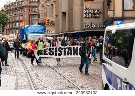 STRASBOURG FRANCE - SEPT 12 2017: Demonstrators with Resistance banner at political march during a French Nationwide day of protest against the labor reform proposed by Emmanuel Macron Government