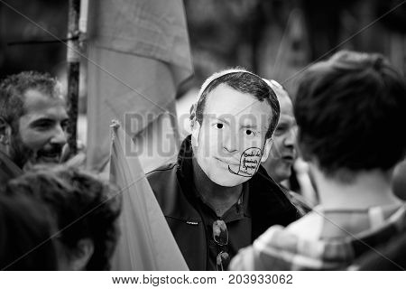 Man Wearing Emmanuel Macron Mask At Protest