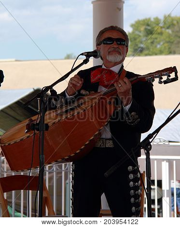 TAOS, NEW MEXICO - OCTOBER 1, 2011: Mexican musician performing on the street concert in Taos, New Mexico