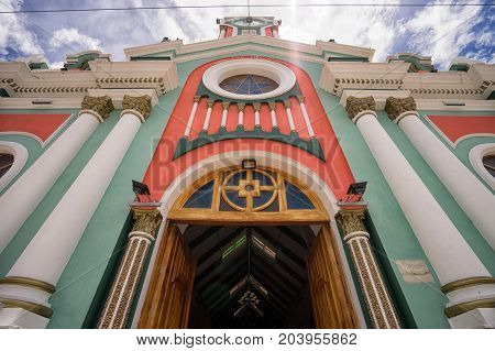 March 12 2017 Vilcabamba Ecuador: colourful church facade in the popular tourist destination town in the Andes