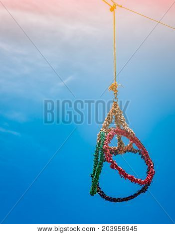 Red green blue yellow loop for sepak takraw game on blue sky background with sunshine