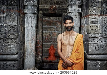 Naggar, India - July 17: Indian Young Brahmin Stands Near The Temple Of Krishna. July 17, 2013 In Na