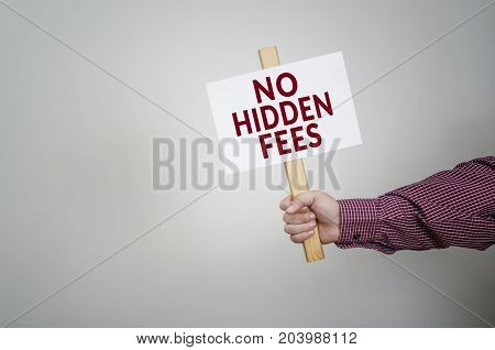 Poster in hand business concept with text No Hidden Fees.