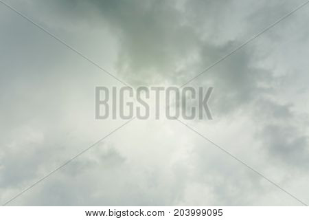 Dramatic green dark sky with stormy clouds background.