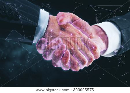 Creative Polygonal Businessmen Handshake On Blurry Dark Background. Communication And Teamwork Conce