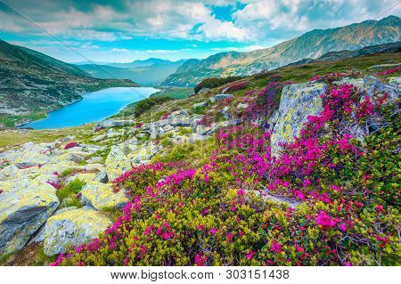 Breathtaking Mountain Glacier Lake And Popular Hiking Place. High Mountains, Cloudy Sky And Stunning