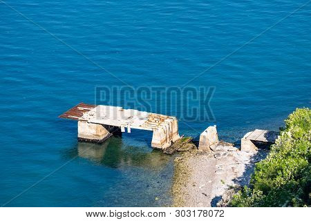 Abandoned Broken Pier On Adriatic Sea In Village Portopiccolo Sistiana Near Triest In Italy, Europe.