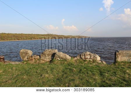 White Lake With Marina And Beach / Photo Of A Large Lake.on Water Are Visible Waves Of.the Pier Is O