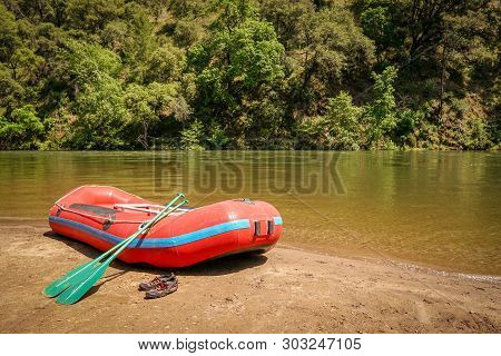 Inflatable Boat Adventure River Raft Ready For Launch On The Shore Of A Mountain Stream