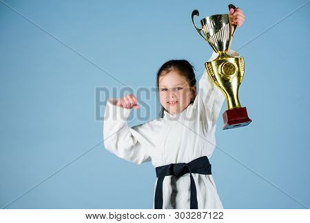 Sport Success In Single Combat. Practicing Kung Fu. Happy Childhood. Winner Little Girl In Gi Sports