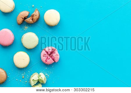 Brignt Macarons For Sweet Break On Blue Background Top View Mock Up
