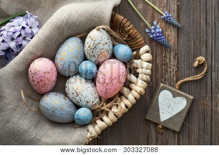 Easter Background With Eggs, Blue Hyacinth Flowers And  Wooden Heart, Top View On Rustic Wood