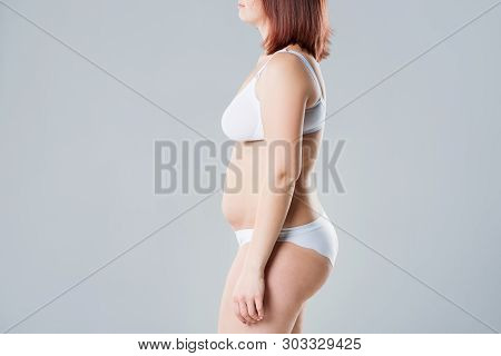 Woman With Fat Flabby Belly, Overweight Female Body On Gray Background