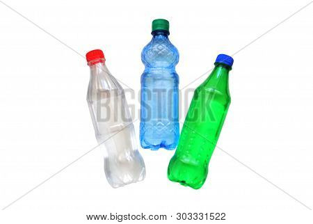 Plastic Bottles Of Three Colors On A White Background