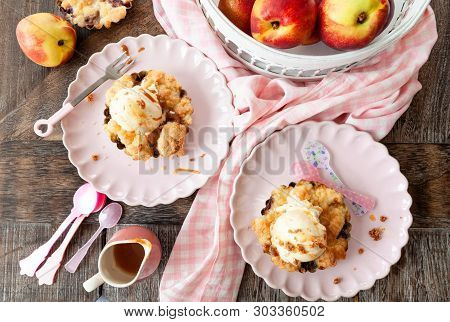 Peach Crumble A La Mode, With A Scoop Of Vanilla Ice Cream