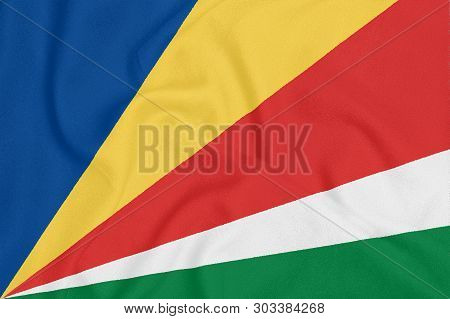 Flag Of Seychelles On Textured Fabric. Patriotic Symbol