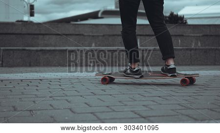 Woman Skateboarder Legs Skateboarding At Grey City