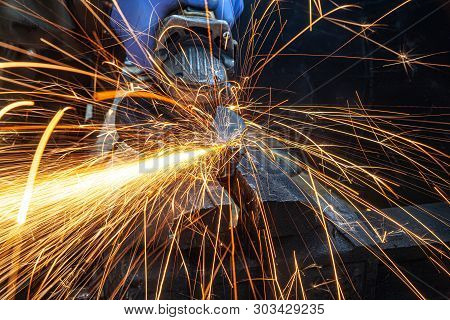 Sparks Flying While Machine Griding And Finishing Metal