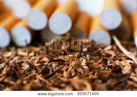 Homemade Cigarettes And Tobacco, Close-up With Copy Space. Cigarette Production