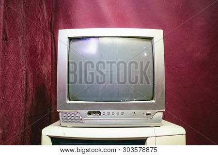 Old Analog Tv With Kinescope On A Red Background