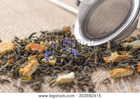 Dried Leaves Of Herbal Green Tea With The Addition Of Citrus Peel And Blue Flowers