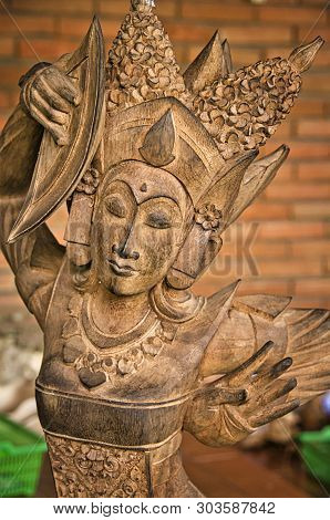 Bali, Indonesia - February Circa, 2019. Close Up Of Wooden Pagan Sculpture Made By Traditional Cabin
