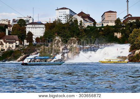 Rhine, Switzerland - September 19, 2018: Tourist Ship On The Rhine River Approaching The Rhine Falls