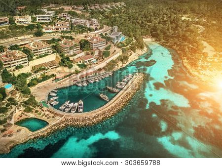 Beautiful birdeye view on the sea coastline with pier and yakhts at sunny day. Travell, jorney,islands, Seascape, freedom, holidays concept.