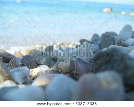 Mediterranean Coast, Multicolored Stones Near And Sea