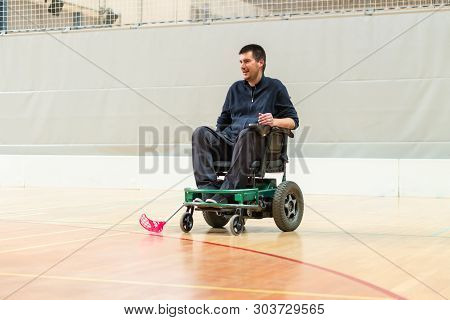Disabled Man On An Electric Wheelchair Playing Sports, Powerchair Hockey. Wheelchair And Amputee Spo
