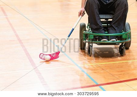 Disabled Man On An Electric Wheelchair Playing Sports, Powerchair Hockey. Wheelchair And Amputee Spo