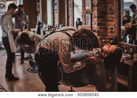 Attractive Brutal Man Just Got Good Beardcare From Talanted Trendy Barber.