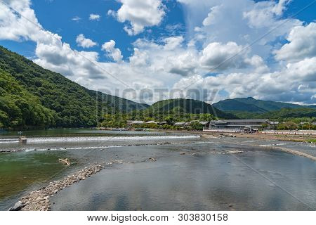 Togetsu-kyo Bridge Over Katsuragawa River With Colourful Forest Mountain Background In Arashiyama Di