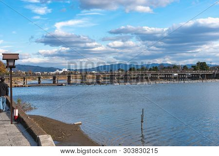 Togetsu-kyo Bridge Over Katsuragawa River With Colourful Forest Mountain Background In Arashiyama Di