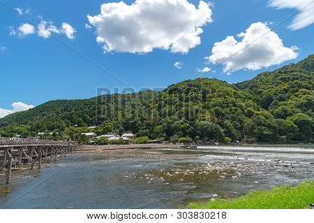 Togetsu-kyo Bridge Over Katsuragawa River With Colourful Forest Mountain Background In Arashiyama Di