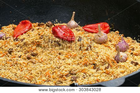 Traditional Oriental Cuisine National Food Fragrant Rice Called Pilaw With Lamb Meat And Vegetables.