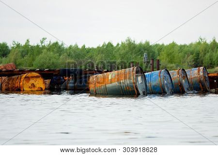 Dumped Oil Drums Cause Pollution In The Water, More And More The Water Is Polluted By Throwing Away 